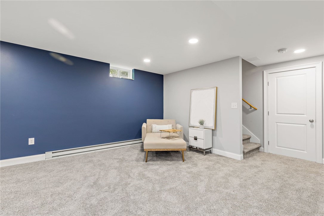 44 Lantern Road Lincoln, RI 02865 - Photo 43 of 50 Lower level family room, view facing stairs. There is external access through the door to the right of the stairs.