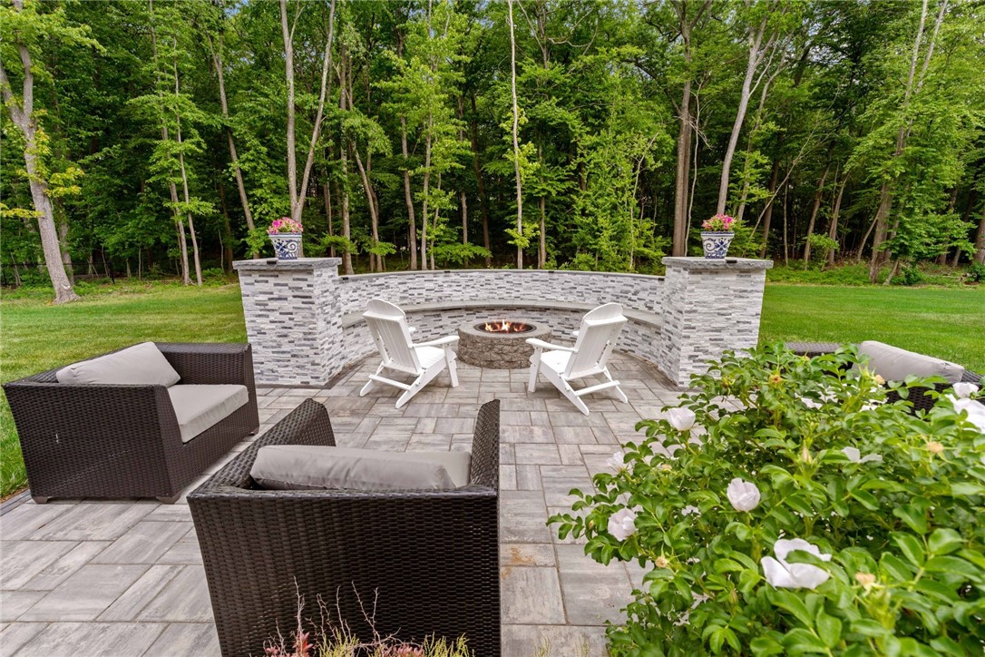 44 Lantern Road Lincoln, RI 02865 - Photo 46 of 50 Brand new patio, fire pit and built-in seating area!