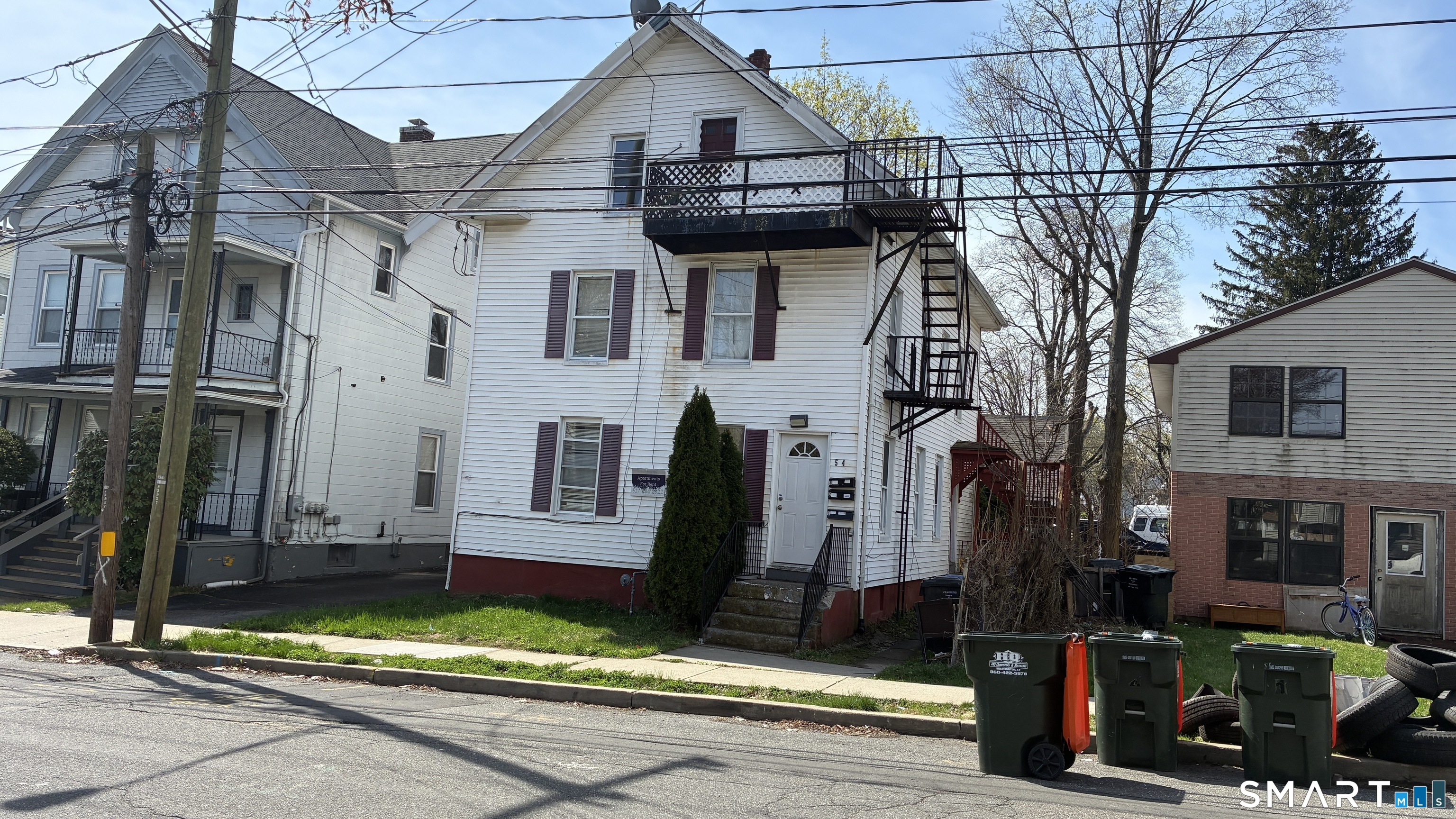 54 North Avenue, Unit 3 Meriden, CT 06451 - Photo 3 of 10 a view of a house with a small yard and plants