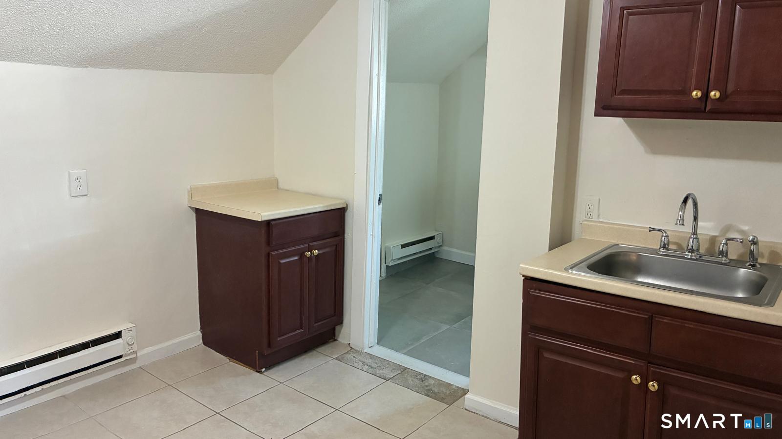 54 North Avenue, Unit 3 Meriden, CT 06451 - Photo 6 of 10 a kitchen with a sink and cabinets
