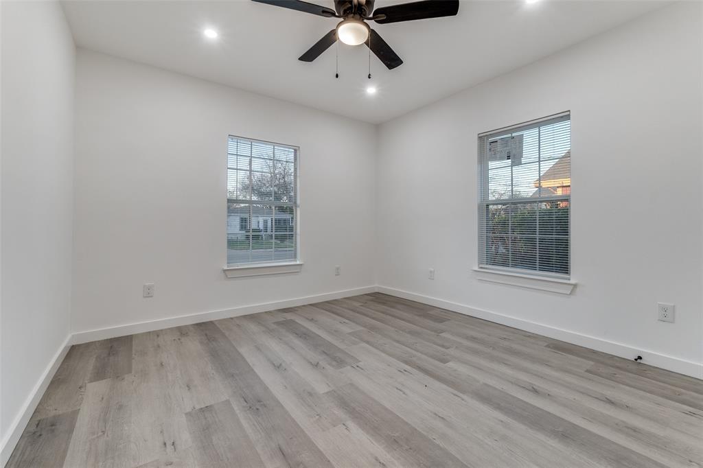 3242 Pine Street Dallas, TX 75215 - Photo 16 of 25 a view of an empty room with wooden floor and a window