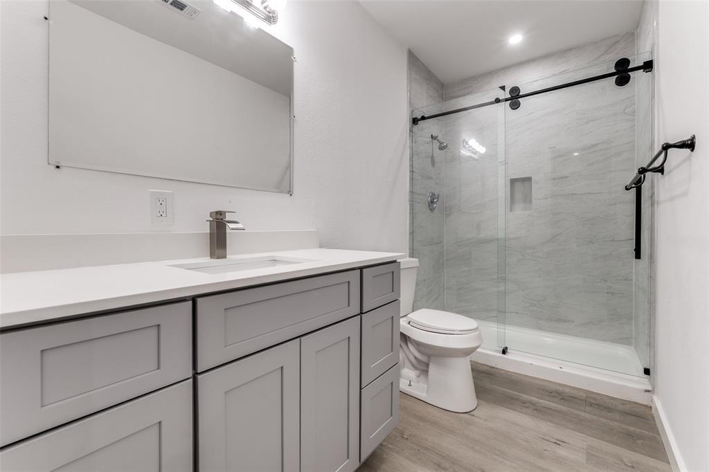 3242 Pine Street Dallas, TX 75215 - Photo 18 of 25 a bathroom with a sink toilet and shower