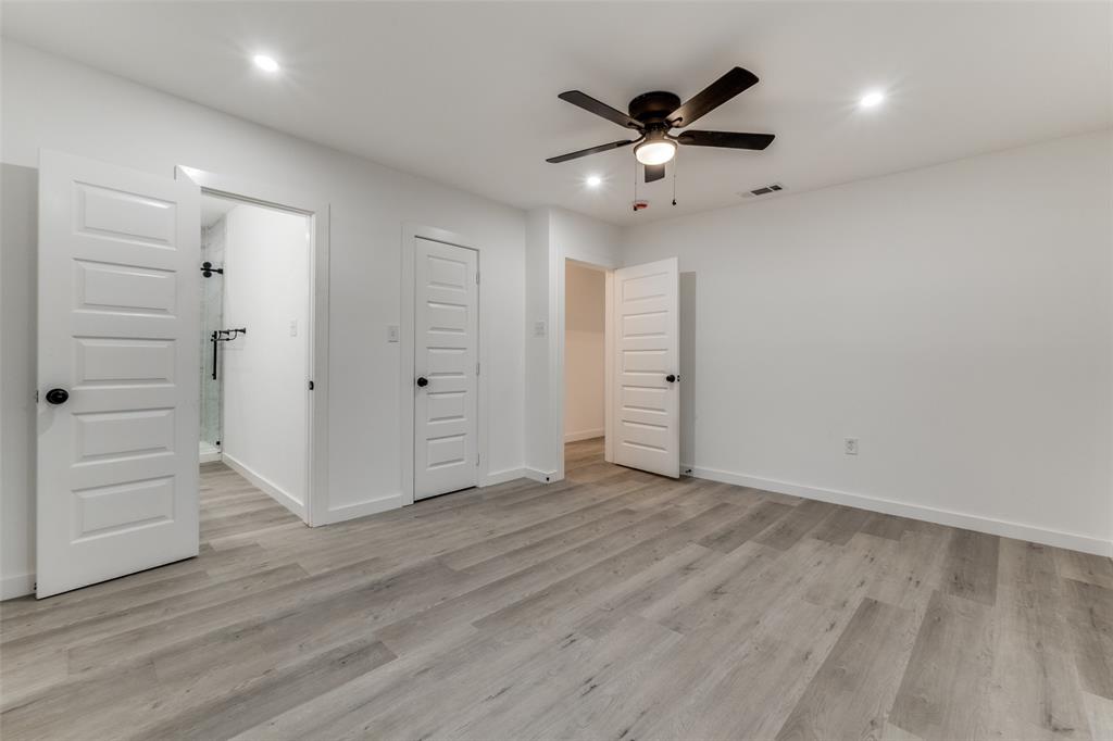 3242 Pine Street Dallas, TX 75215 - Photo 20 of 25 wooden floor in an empty room with a ceiling fan