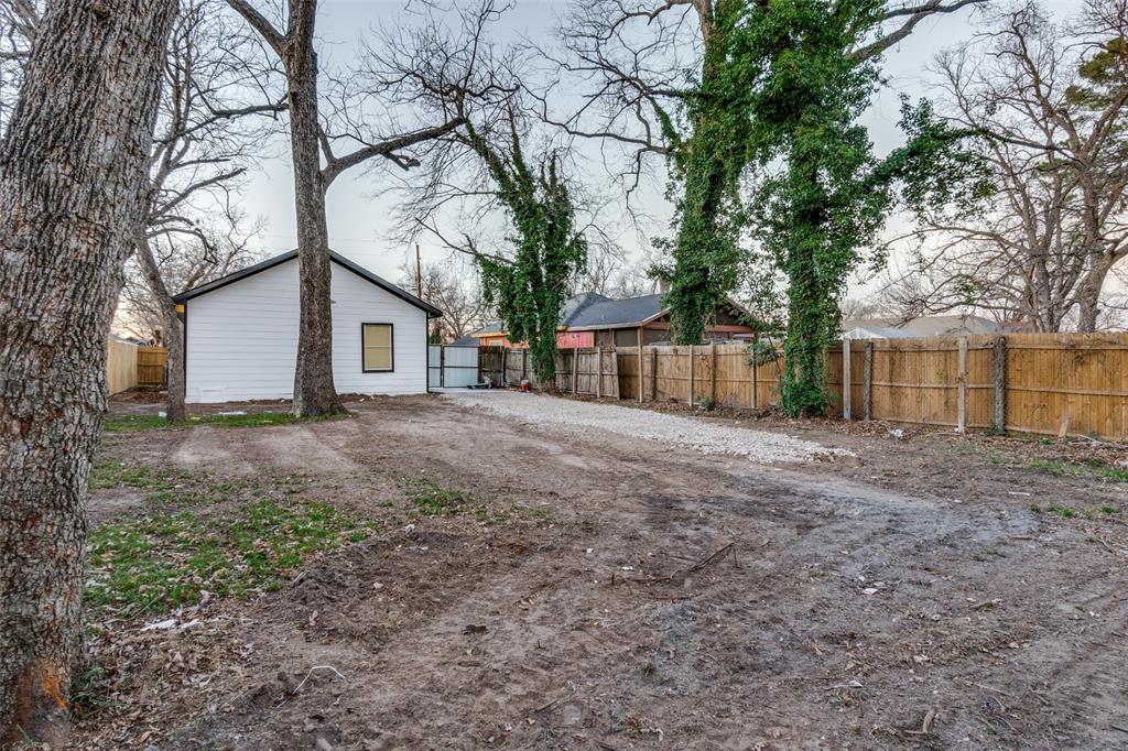 3242 Pine Street Dallas, TX 75215 - Photo 24 of 25 a view of a house with yard and a tree