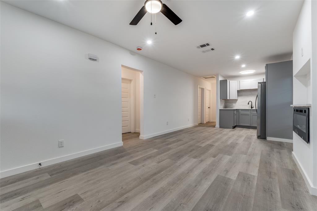 3242 Pine Street Dallas, TX 75215 - Photo 8 of 25 a view of an empty room with a kitchen