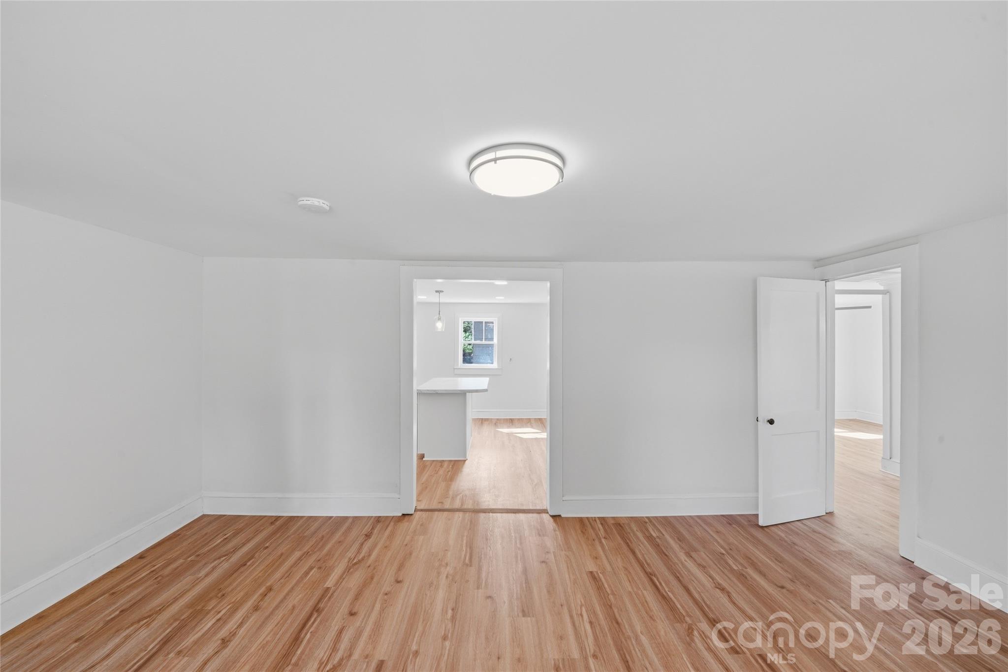 2231 Claremont Road Newton, NC 28658 - Photo 26 of 39 a view of empty room with wooden floor