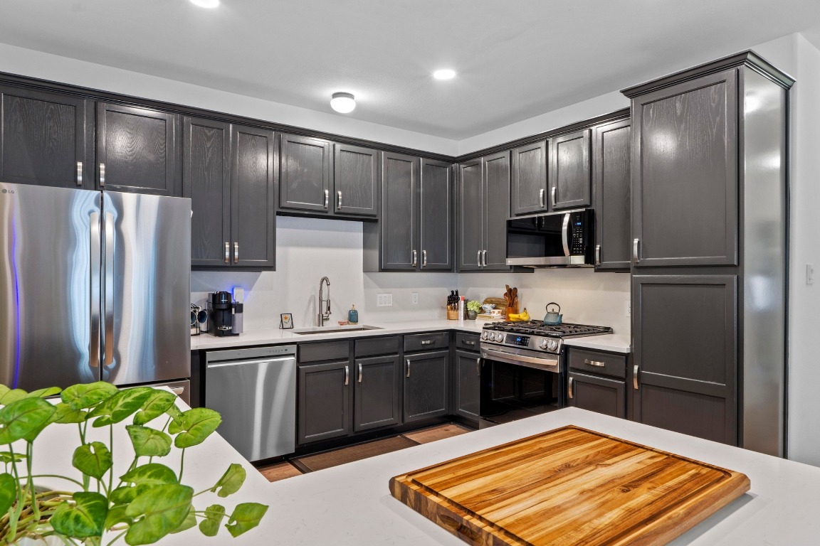 6801 Beckett Road, Unit 131R Austin, TX 78749 - Photo 1 of 26 a kitchen with stainless steel appliances granite countertop a stove refrigerator and sink