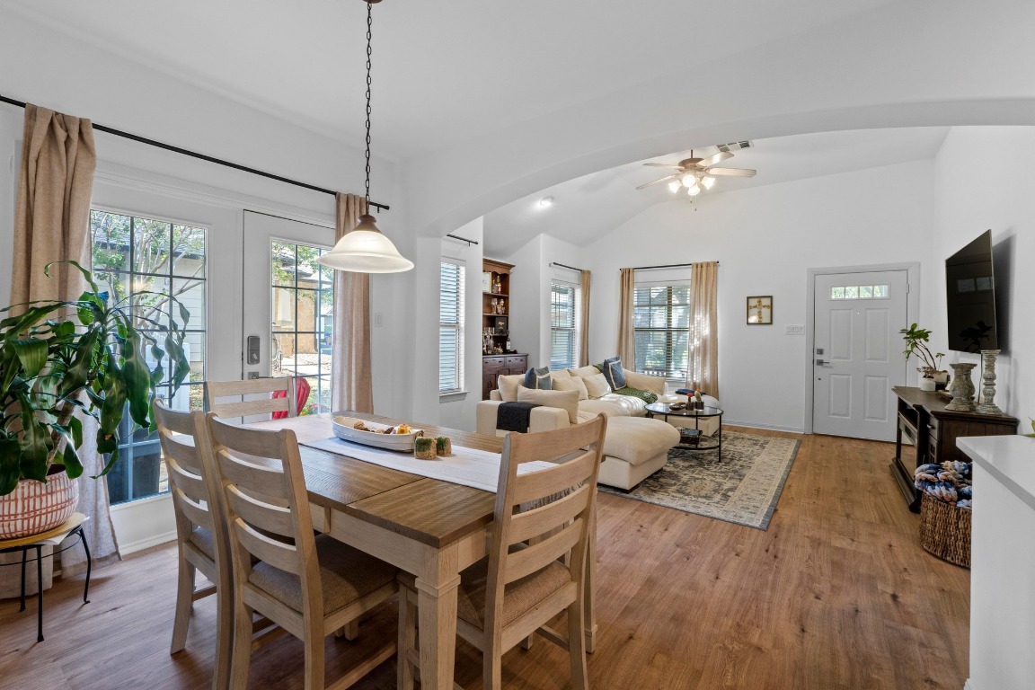 6801 Beckett Road, Unit 131R Austin, TX 78749 - Photo 12 of 26 a view of a dining room with furniture window and wooden floor