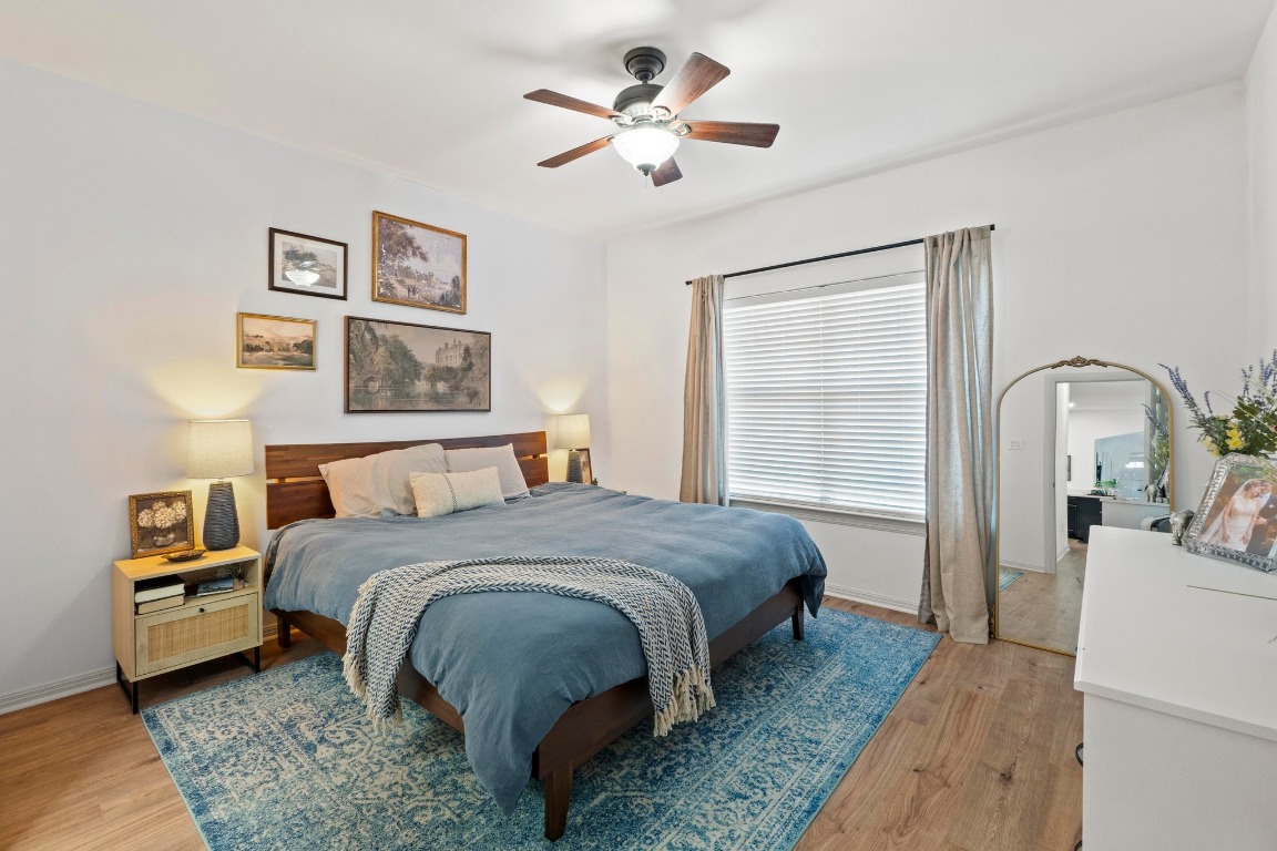 6801 Beckett Road, Unit 131R Austin, TX 78749 - Photo 14 of 26 a bedroom with a bed and a chandelier