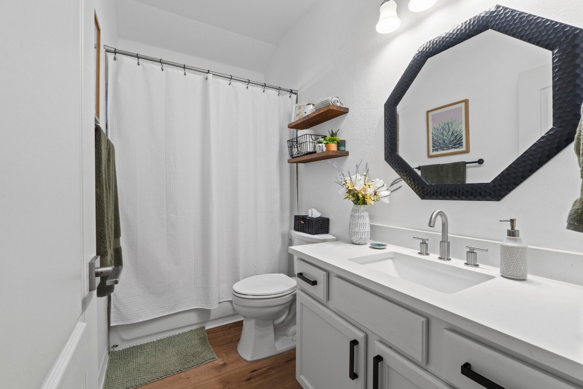 6801 Beckett Road, Unit 131R Austin, TX 78749 - Photo 19 of 26 a bathroom with a sink a toilet and shower