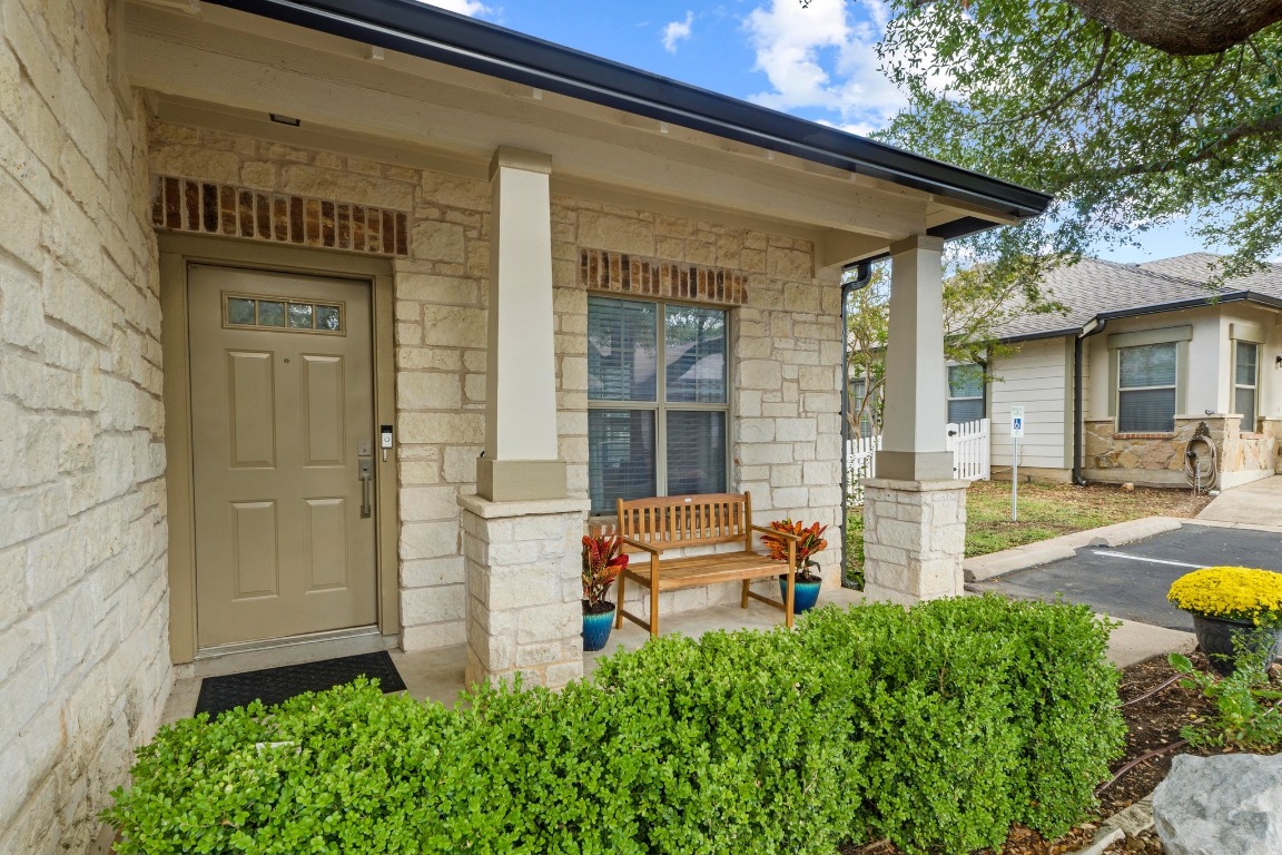6801 Beckett Road, Unit 131R Austin, TX 78749 - Photo 22 of 26 a front view of a house with garden