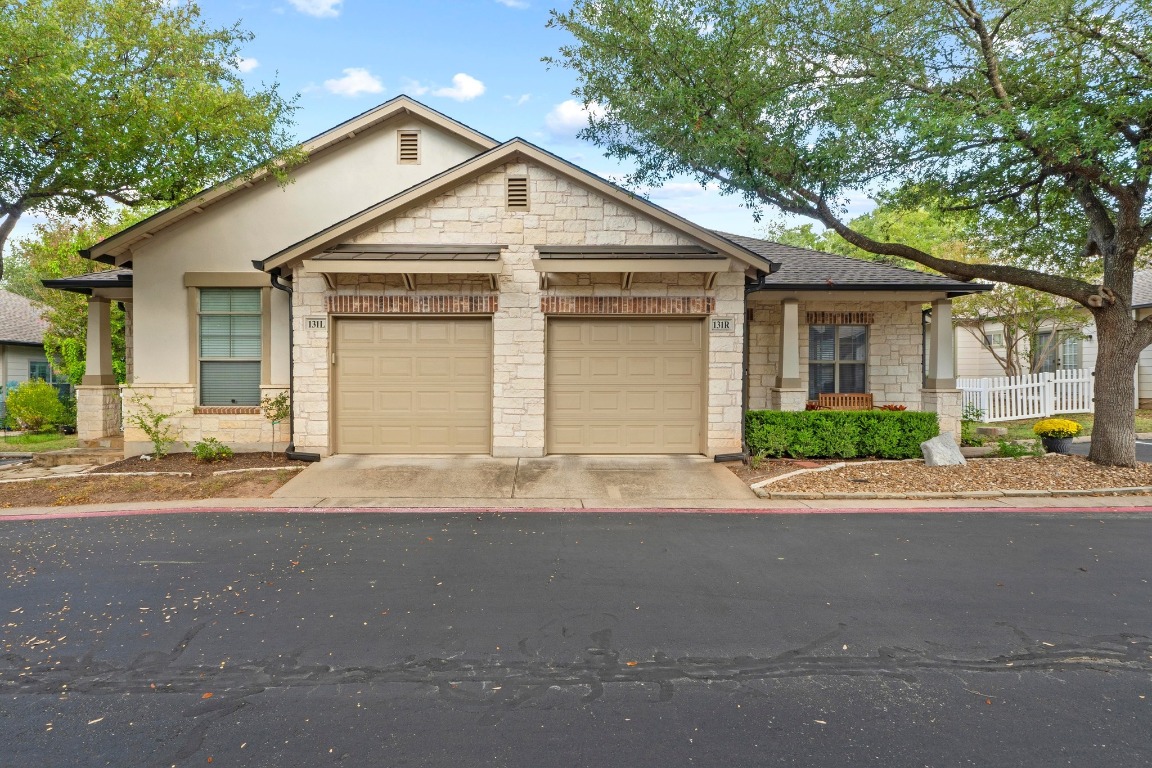 6801 Beckett Road, Unit 131R Austin, TX 78749 - Photo 26 of 26 a view of a house with a yard and garage