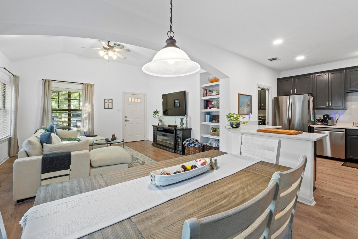 6801 Beckett Road, Unit 131R Austin, TX 78749 - Photo 6 of 26 a living room with furniture a chandelier and a flat screen tv