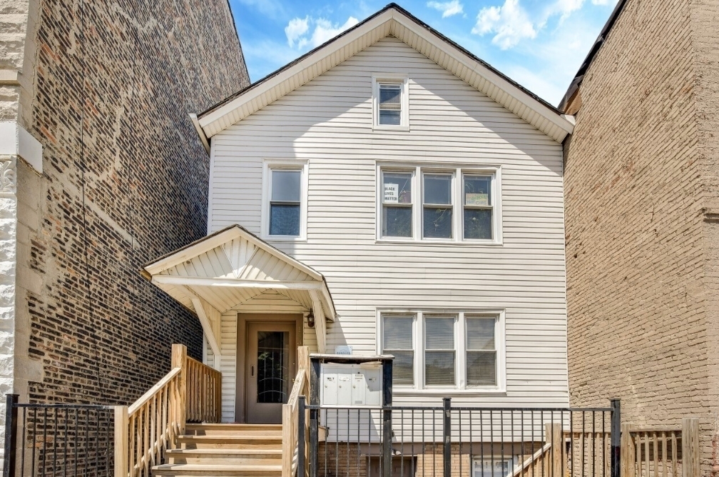 1838 South Racine Avenue Chicago, IL 60608 - Photo 1 of 16 a front view of a house with a porch