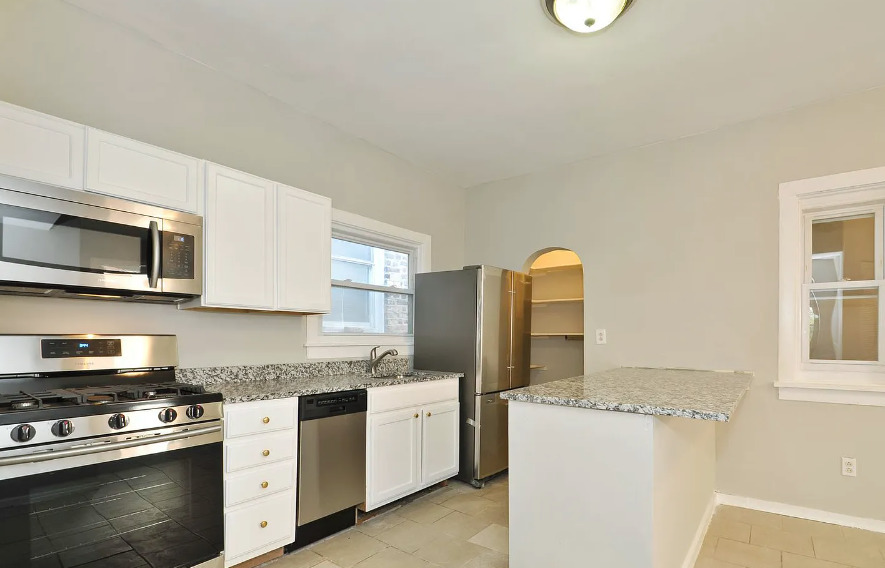 1838 South Racine Avenue Chicago, IL 60608 - Photo 12 of 16 a kitchen with a stove and a refrigerator