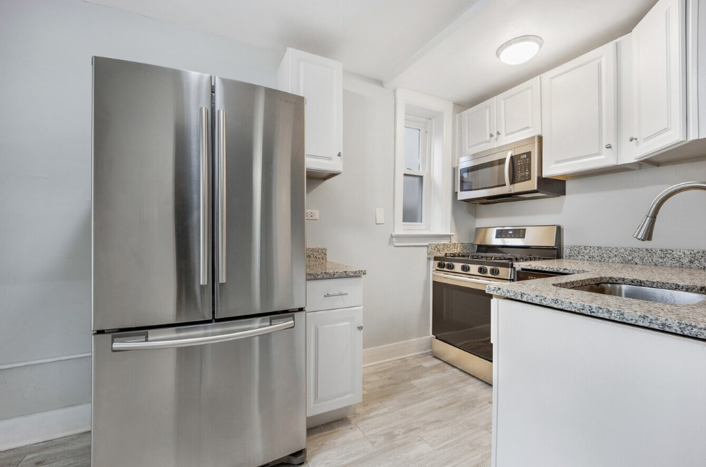 1838 South Racine Avenue Chicago, IL 60608 - Photo 3 of 16 a kitchen with stainless steel appliances a refrigerator stove and microwave