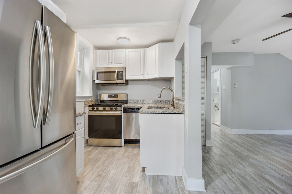 1838 South Racine Avenue Chicago, IL 60608 - Photo 4 of 16 a kitchen with a refrigerator and a stove top oven