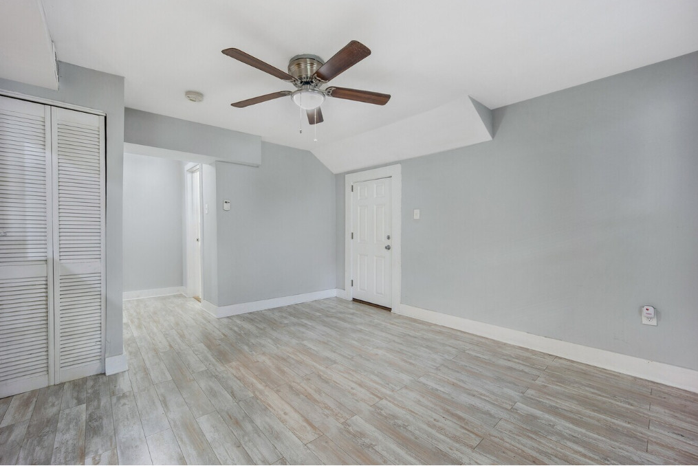 1838 South Racine Avenue Chicago, IL 60608 - Photo 6 of 16 an empty room with wooden floor and windows