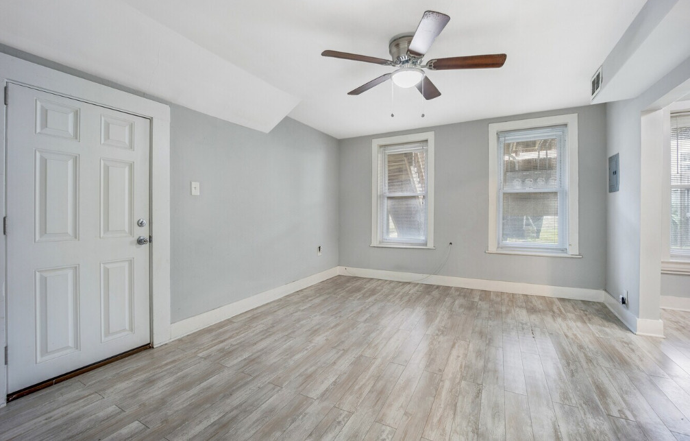 1838 South Racine Avenue Chicago, IL 60608 - Photo 7 of 16 wooden floor in an empty room with a window
