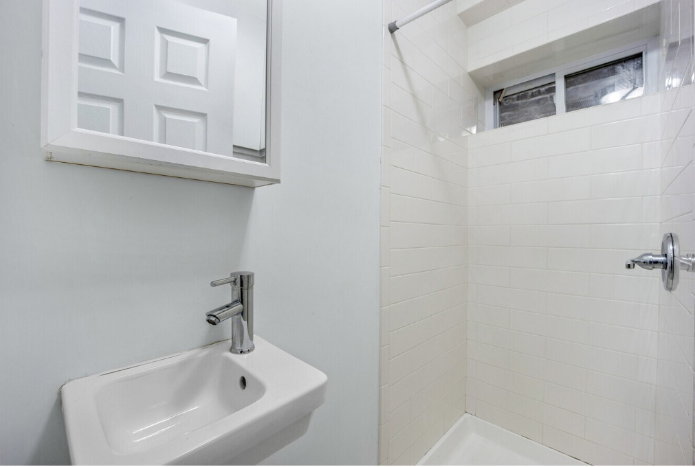 1838 South Racine Avenue Chicago, IL 60608 - Photo 9 of 16 a bathroom with a sink and mirror