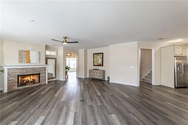 a kitchen with granite countertop white cabinets and stainless steel appliances