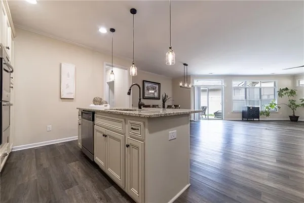 a bathroom with a sink shower and a mirror