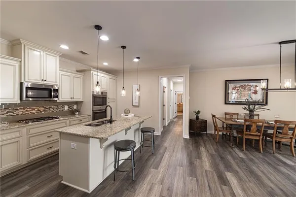 a bathroom with a double vanity sink a mirror and a shower