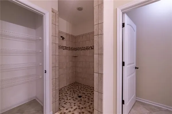 a view of a livingroom with wooden floor and lounge chairs