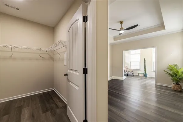 a view of entryway and hall with wooden floor