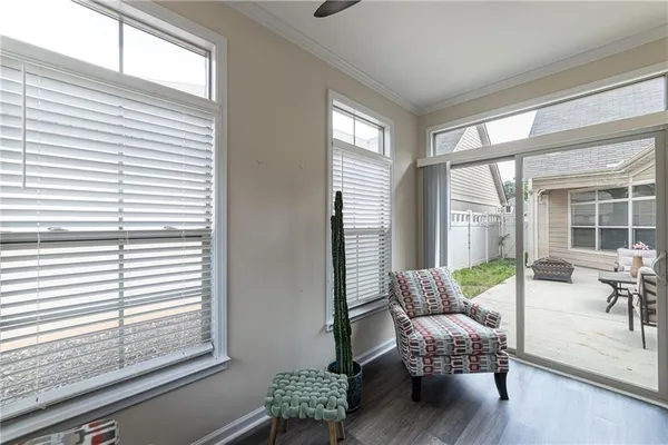 a view of a patio with table and chairs and wooden floor
