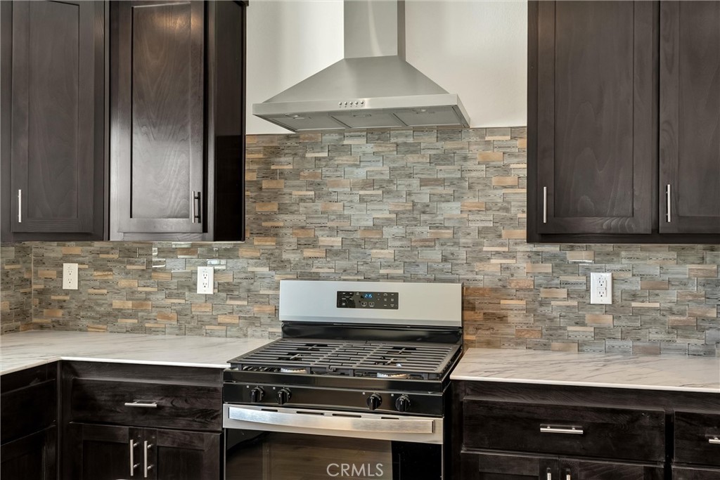 4333 Pentz Road, Unit 30 Paradise, CA 95969 - Photo 14 of 29 a kitchen with granite countertop a stove sink and cabinets