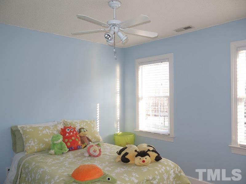 4441 Emmit Drive Raleigh, NC 27604 - Photo 14 of 19 a bedroom with furniture and a window