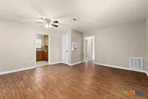 a view of an empty room with a window