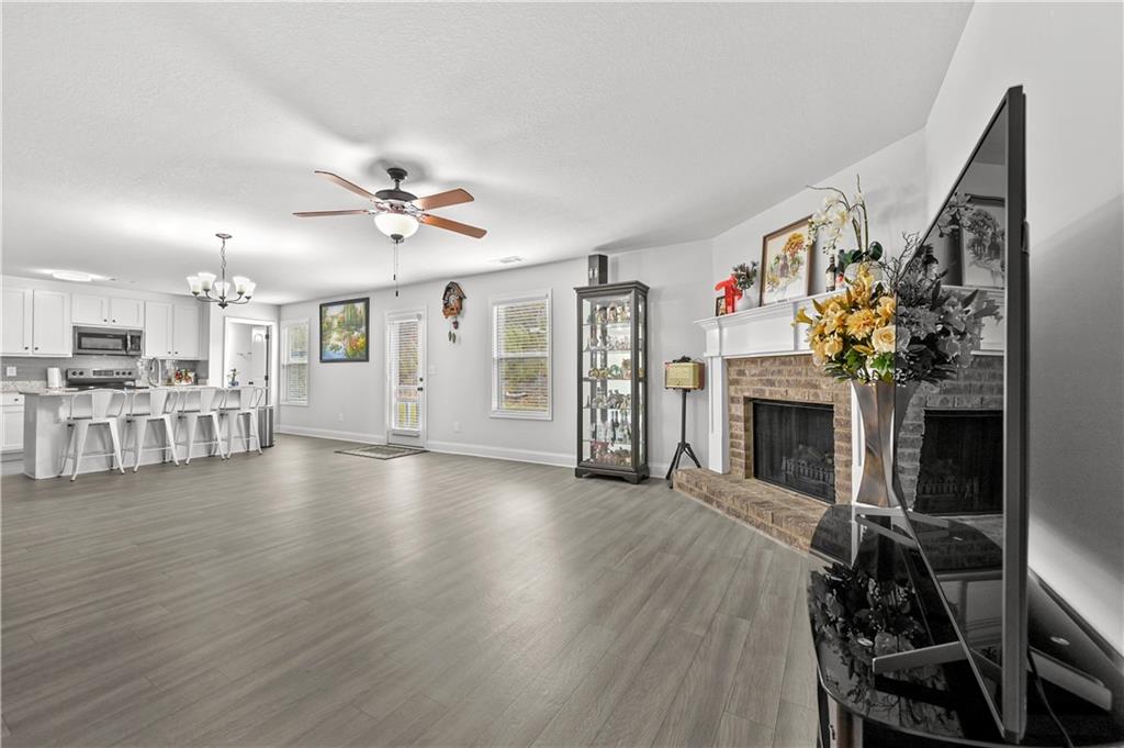 68 Suwannee Way Jefferson, GA 30549 - Photo 12 of 28 a view of a livingroom with furniture and a fireplace