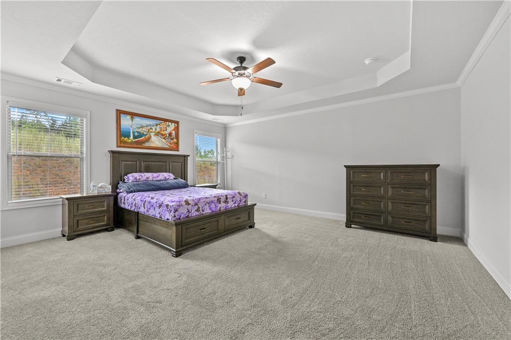 68 Suwannee Way Jefferson, GA 30549 - Photo 19 of 28 a bedroom with a bed dresser and window