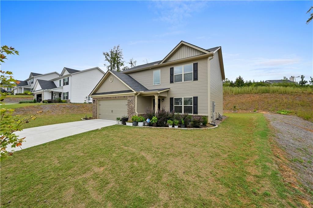 68 Suwannee Way Jefferson, GA 30549 - Photo 2 of 28 a front view of a house with a yard