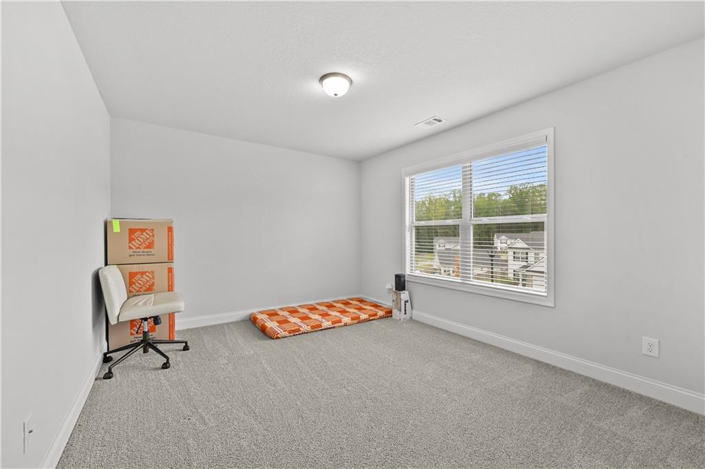 68 Suwannee Way Jefferson, GA 30549 - Photo 24 of 28 a room with toys and a window