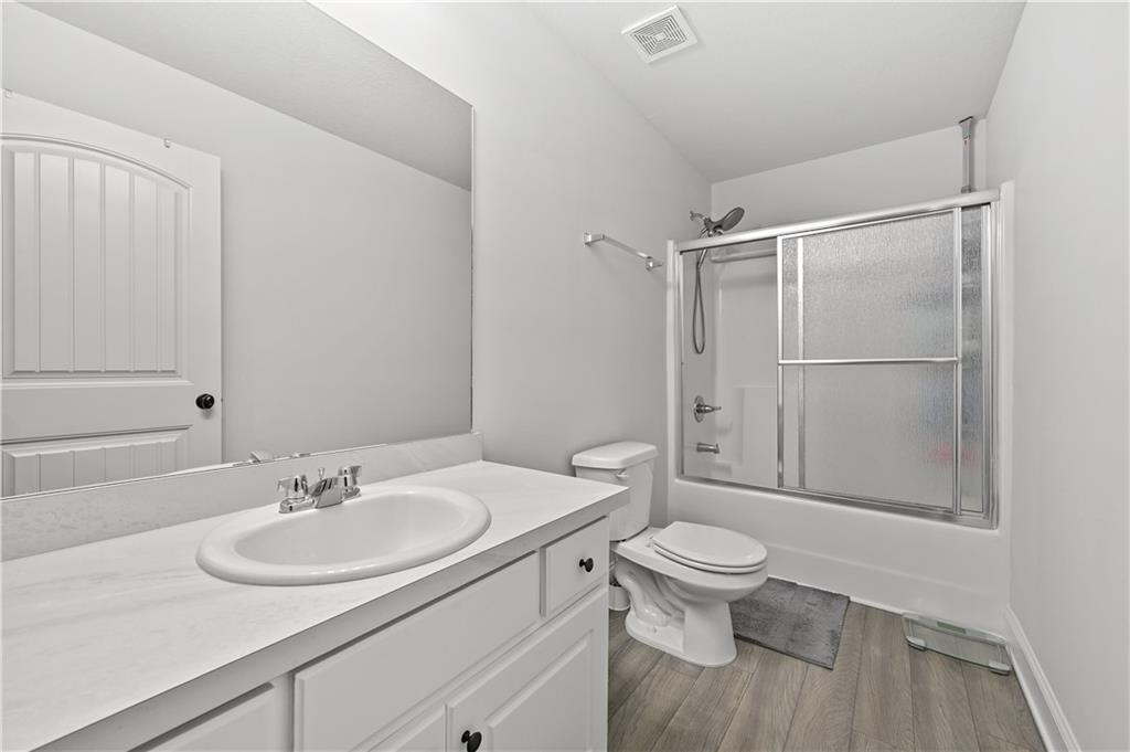 68 Suwannee Way Jefferson, GA 30549 - Photo 28 of 28 a bathroom with a sink toilet and a mirror