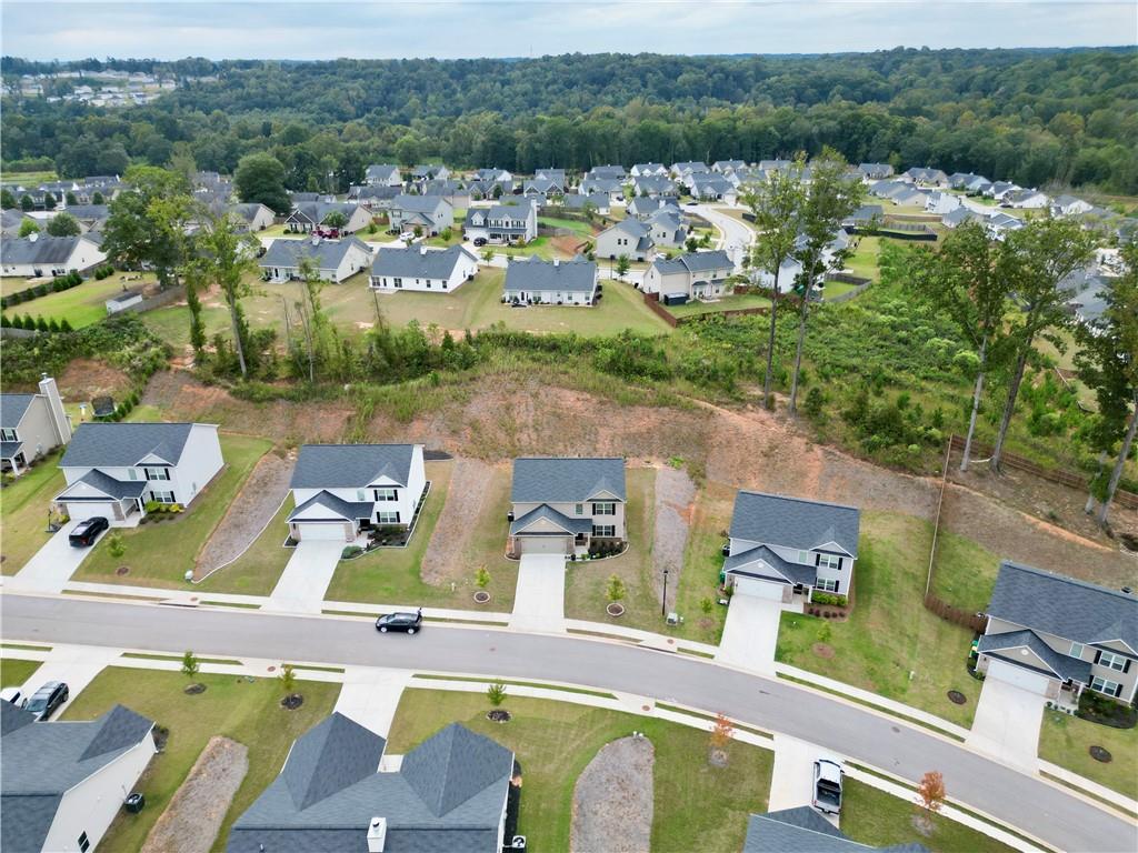 68 Suwannee Way Jefferson, GA 30549 - Photo 4 of 28 an aerial view of a house with a lake view