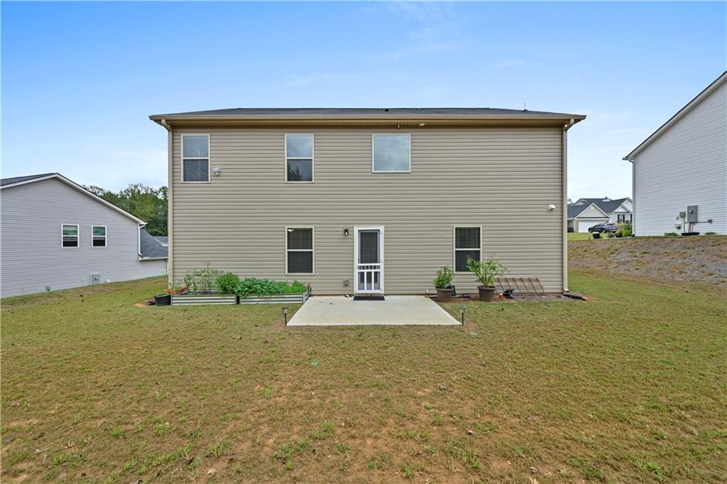 68 Suwannee Way Jefferson, GA 30549 - Photo 7 of 28 a front view of a house with a yard