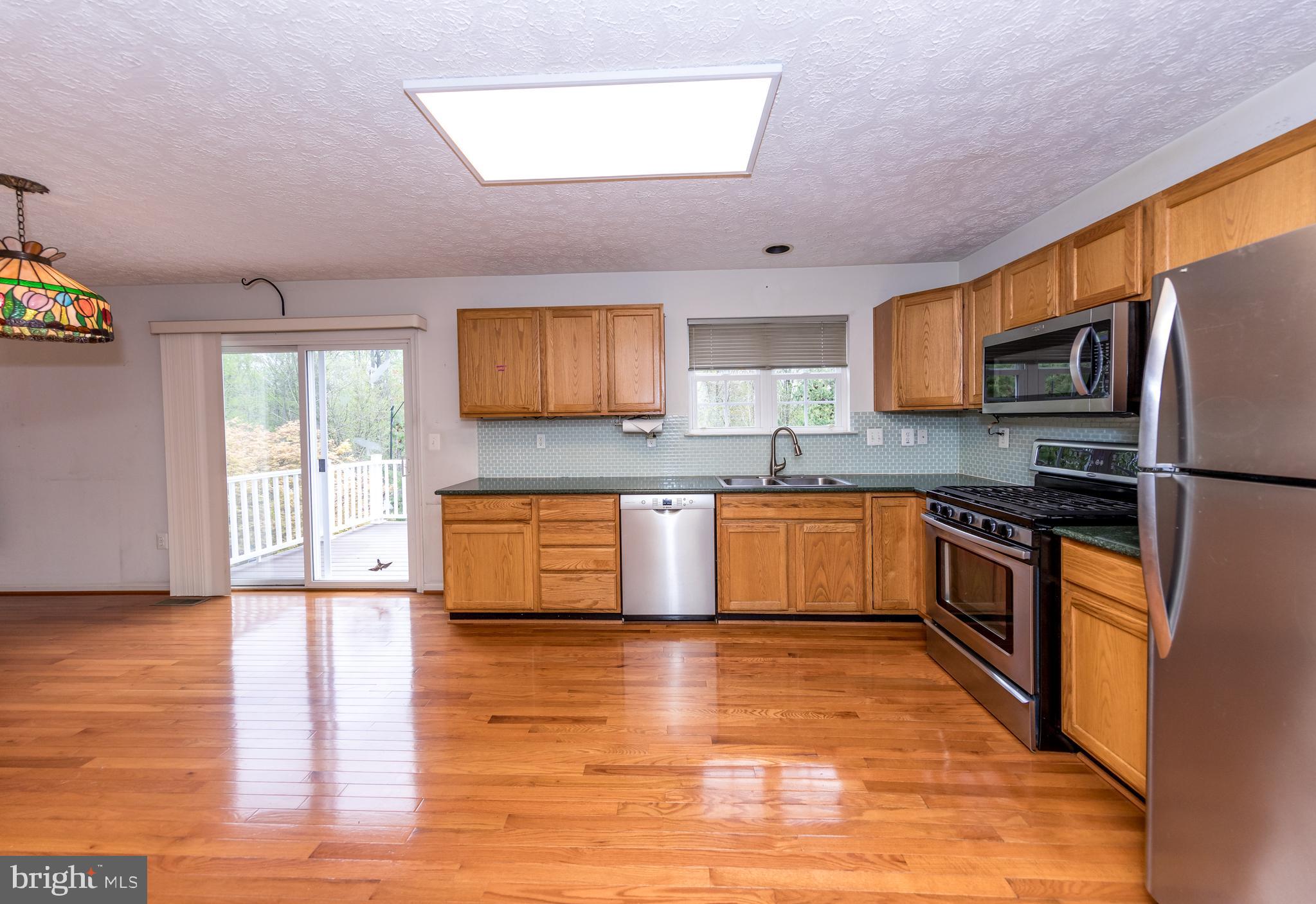 567 Beards Hill Road Aberdeen, MD 21001 - Photo 14 of 43 Kitchen with sliders leading to the deck