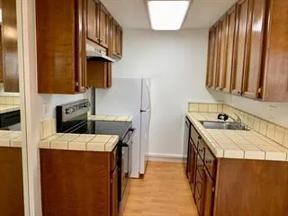 a kitchen with a stove and a refrigerator