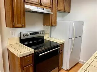 a view of a sink storage and utility room with washer and dryer