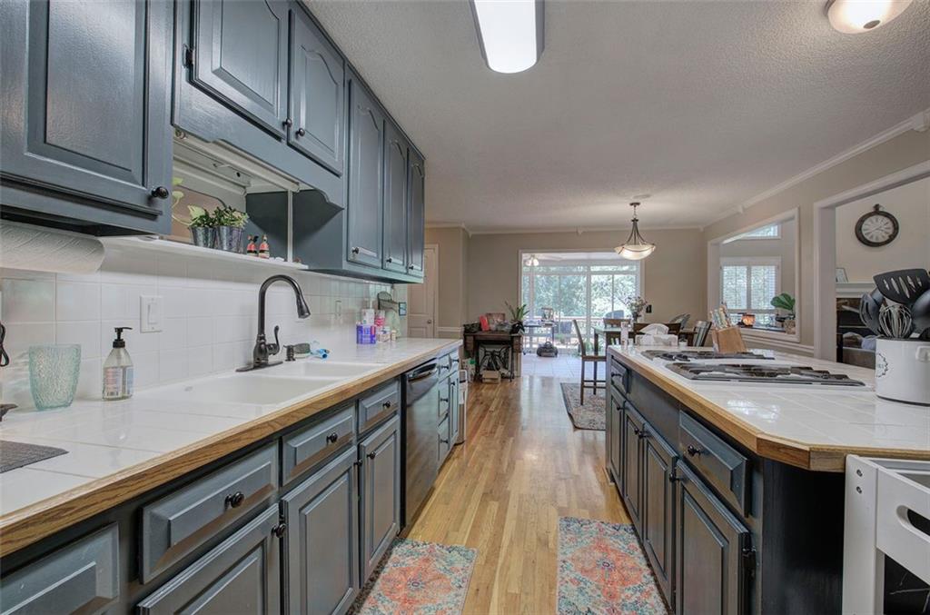 915 Oak Grove Road Carrollton, GA 30117 - Photo 12 of 57 a kitchen with lots of counter space and a sink