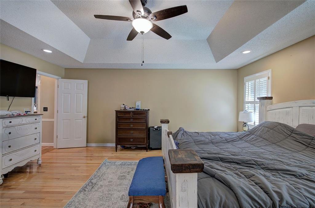 915 Oak Grove Road Carrollton, GA 30117 - Photo 20 of 57 a bedroom with a bed and a flat screen tv