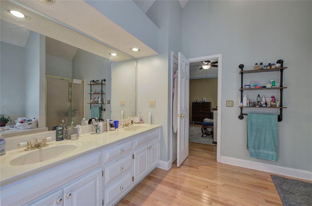 915 Oak Grove Road Carrollton, GA 30117 - Photo 24 of 57 a spacious bathroom with double vanity sinks and a large mirror