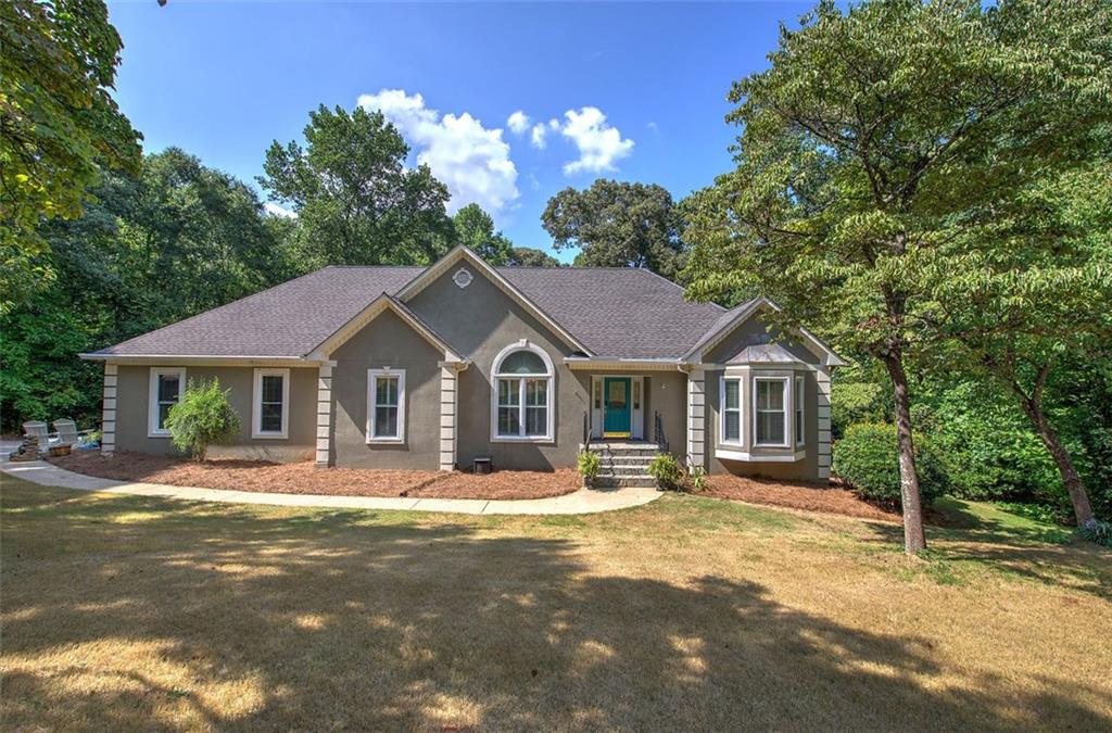 915 Oak Grove Road Carrollton, GA 30117 - Photo 3 of 57 a front view of a house with a yard