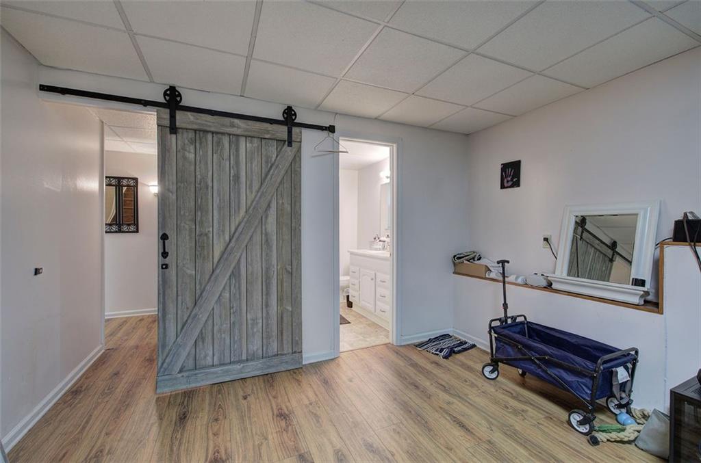 915 Oak Grove Road Carrollton, GA 30117 - Photo 34 of 57 a view of a hallway with wooden floor and staircase