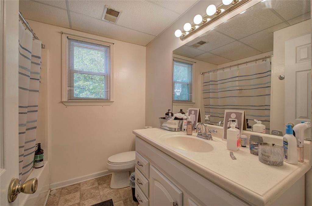 915 Oak Grove Road Carrollton, GA 30117 - Photo 36 of 57 a bathroom with a toilet sink and mirror