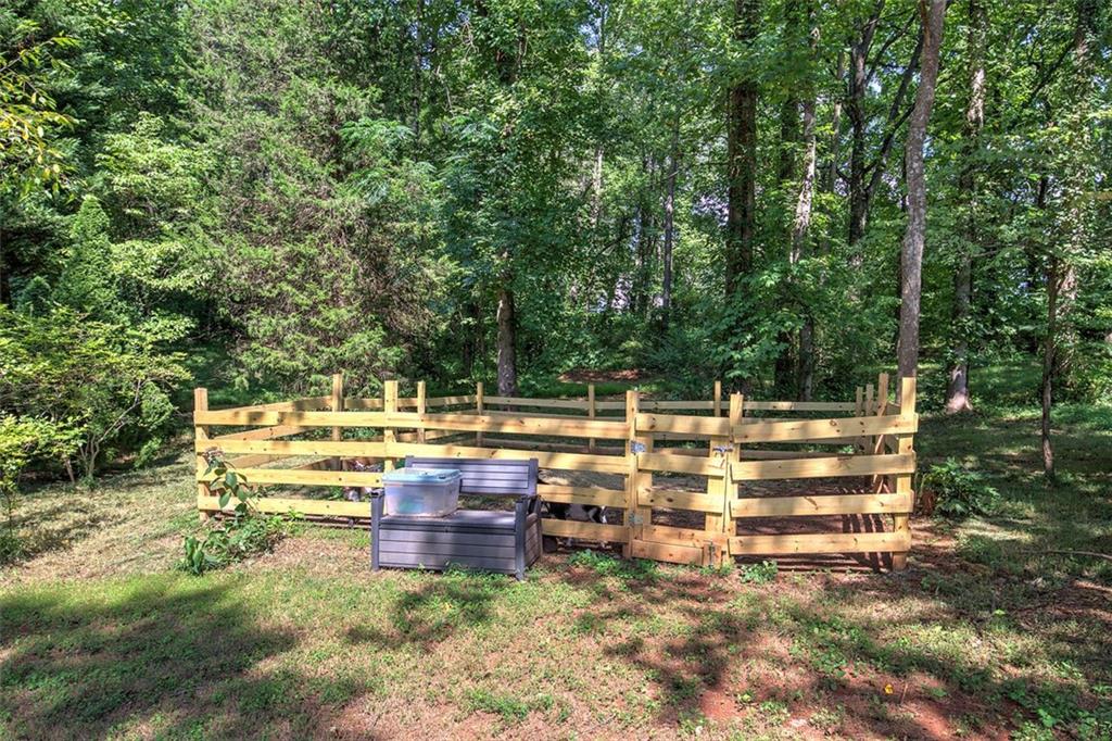 915 Oak Grove Road Carrollton, GA 30117 - Photo 41 of 57 a view of backyard with seating area and trees